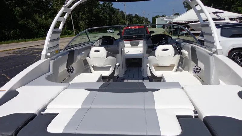 Slide: The Image of 2025 Chaparral 23 SSi boat interior with white seating and modern design. - 7