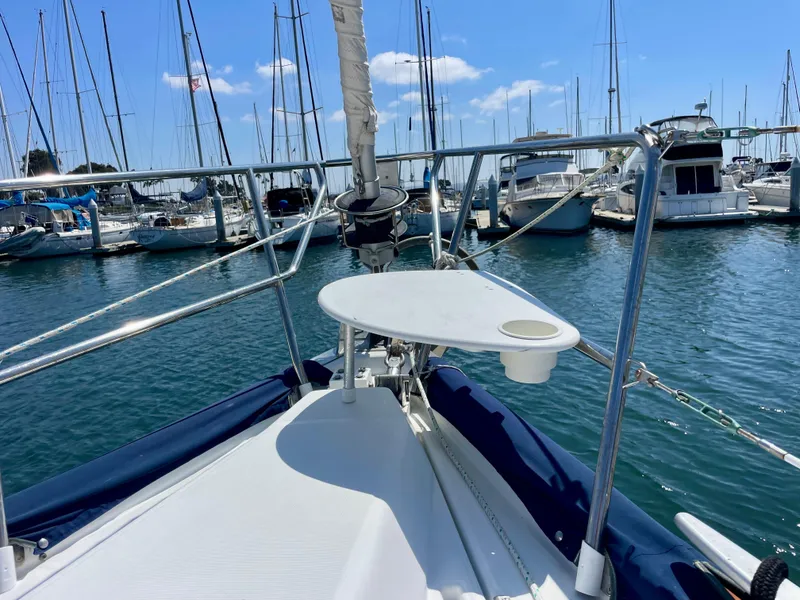 Slide: The Image of Sailboat deck view, Beneteau 423, 2007, docked in marina with clear blue sky. - 10