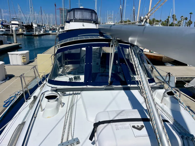Slide: The Image of 2007 Beneteau 423 sailboat docked at marina, showcasing deck and cockpit area. - 11