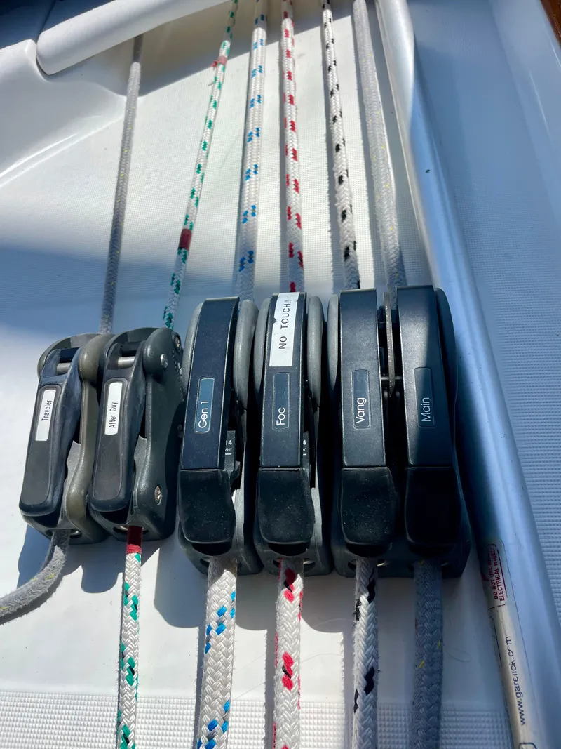 Slide: The Image of Close-up of rope clutches on a 2007 Beneteau 423 sailboat deck. - 18