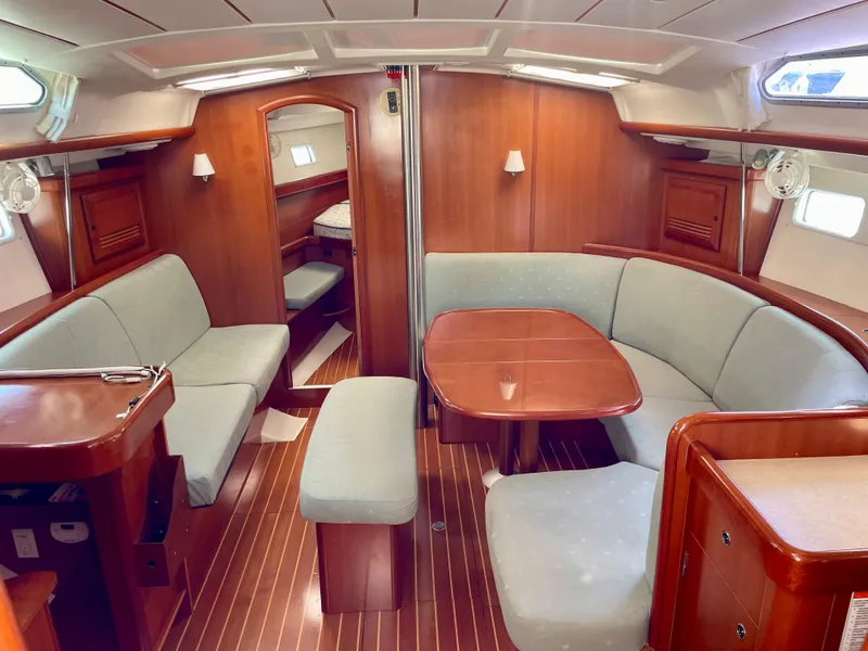Slide: The Image of Spacious interior of 2007 Beneteau 423 sailboat with elegant wood finish and comfortable seating. - 22