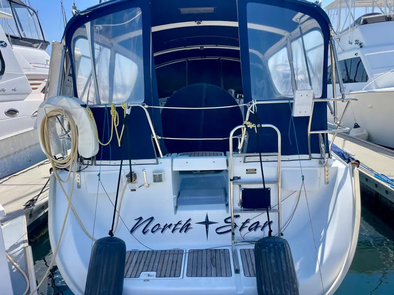 Slide: The Image of Beneteau 423 sailboat, 2007 model, docked at marina with "North Star" on stern. - 3