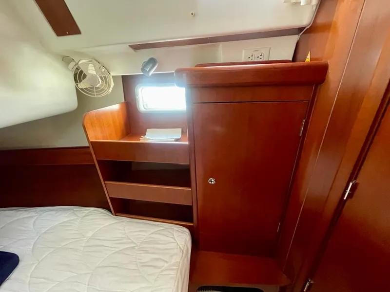 Slide: The Image of Interior cabin of 2007 Beneteau 423 yacht with wooden storage and bed. - 30