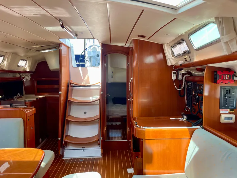 Slide: The Image of Interior of 2007 Beneteau 423 sailboat with wood finish and modern amenities. - 35