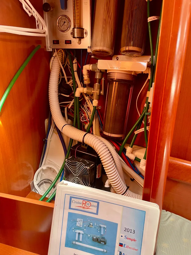 Slide: The Image of Water filtration system inside a 2007 Beneteau 423 yacht, featuring various tubes and components. - 40