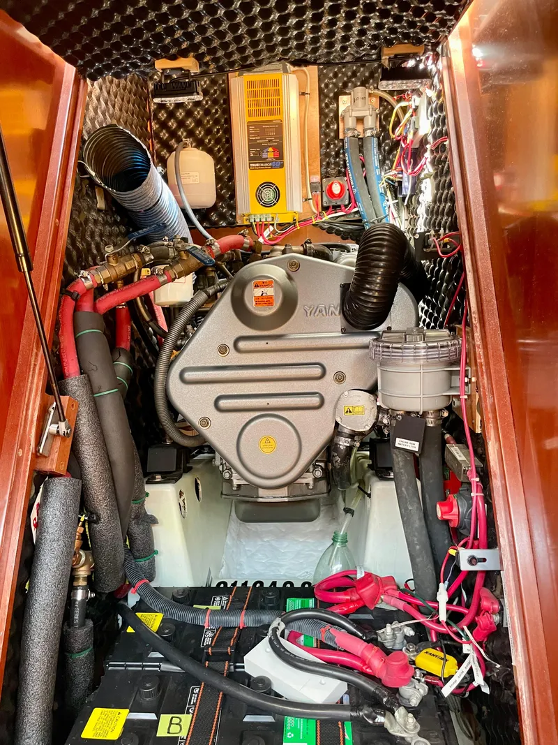 Slide: The Image of Engine compartment of a 2007 Beneteau 423 sailboat, showcasing intricate wiring and components. - 43