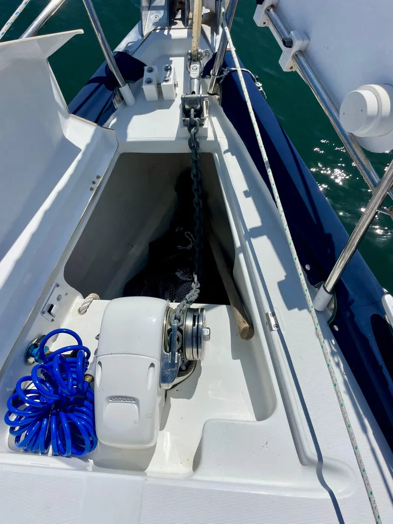 Slide: The Image of Beneteau 423 sailboat anchor locker with chain and blue rope, 2007 model. - 6