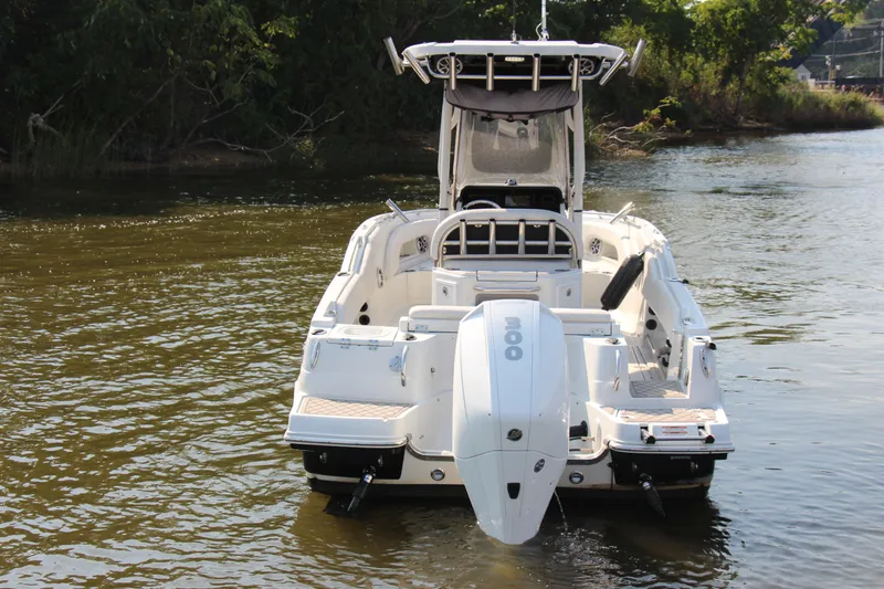 Slide: The Image of 2022 Finseeker 230 CC boat on water, rear view, with outboard motor. - 27