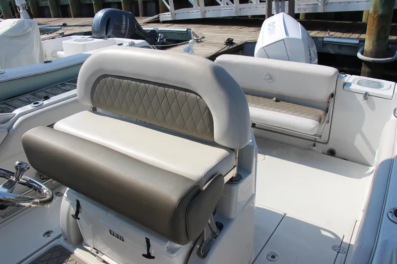 Slide: The Image of 2022 Finseeker 230 CC boat interior with cushioned seating and modern design. - 7