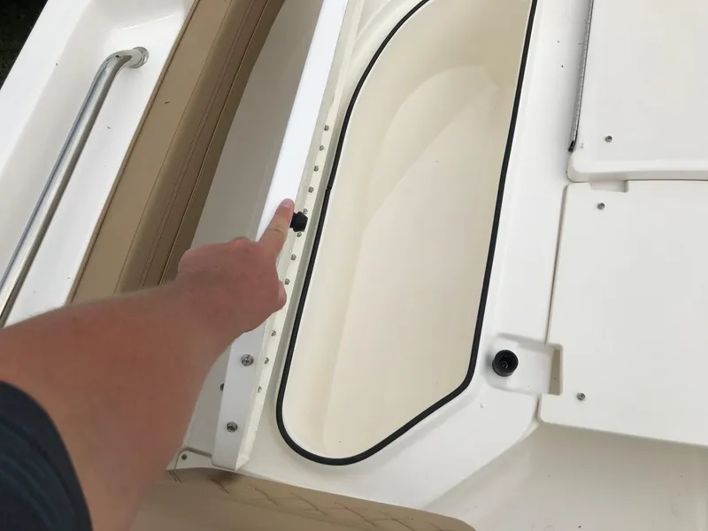 Slide: The Image of 2024 Bayliner Trophy T24CC boat interior detail with storage compartment. - 17