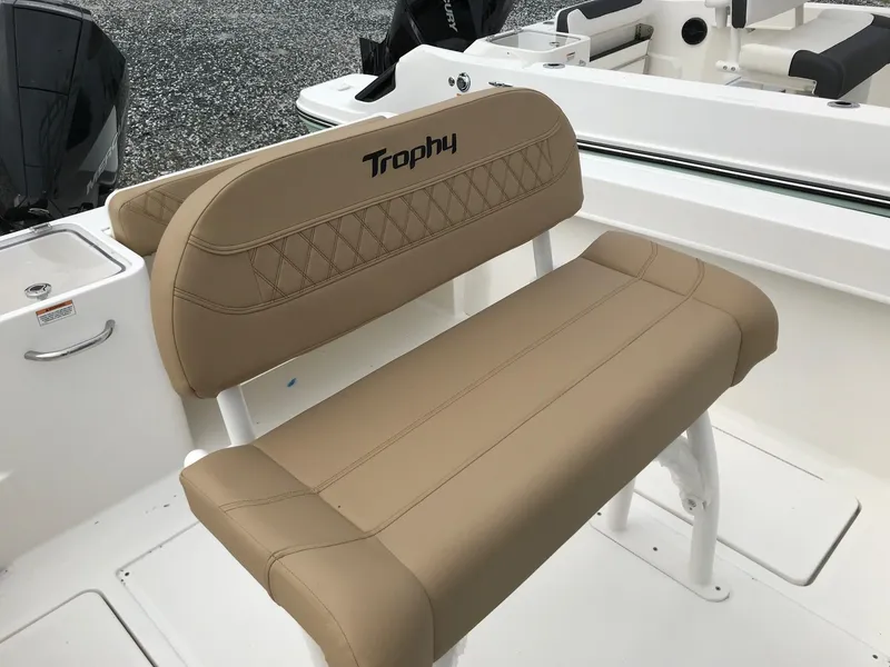 Slide: The Image of 2024 Bayliner Trophy T24CC boat seat with tan upholstery and diamond stitching. - 9