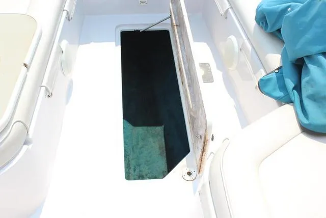 Slide: The Image of Open storage compartment on 1994 Chaparral 220 Sunesta Deck boat. - 8