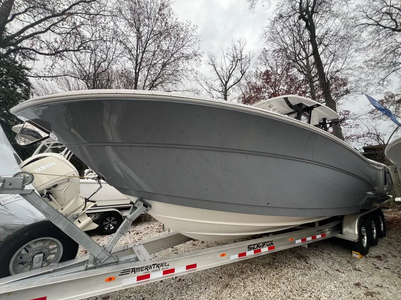 The Image of 2025 Sea Fox 328 Commander boat on trailer, parked outdoors. - 0
