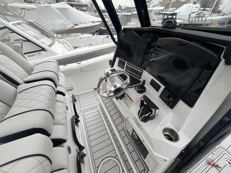 Slide: The Image of 2025 Sea Fox 328 Commander boat interior with modern dashboard and seating. - 3