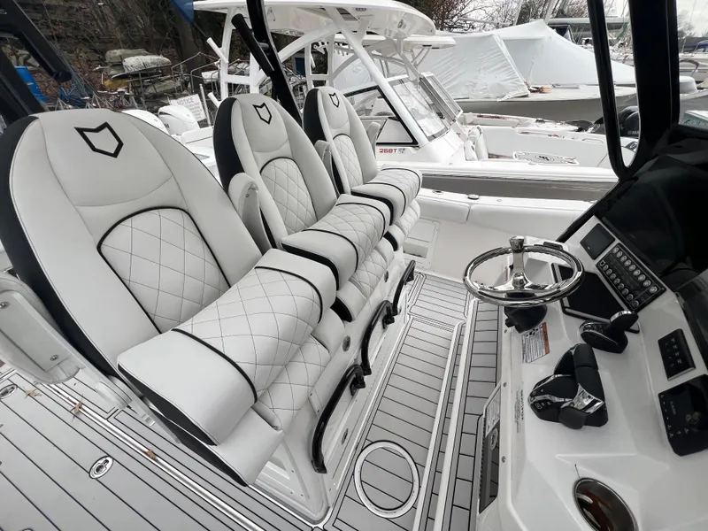 Slide: The Image of 2025 Sea Fox 328 Commander boat interior with luxurious seating and modern controls. - 4