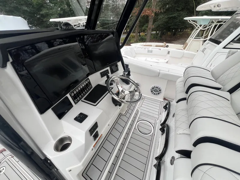Slide: The Image of 2025 Sea Fox 328 Commander boat interior with modern dashboard and seating. - 5