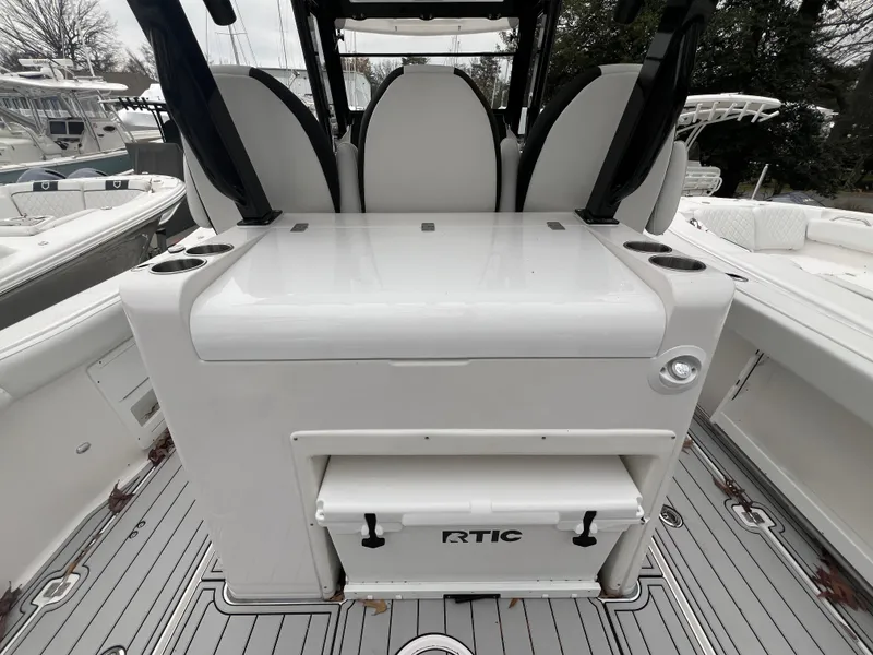 Slide: The Image of 2025 Sea Fox 328 Commander boat interior with seating and RTIC cooler. - 8