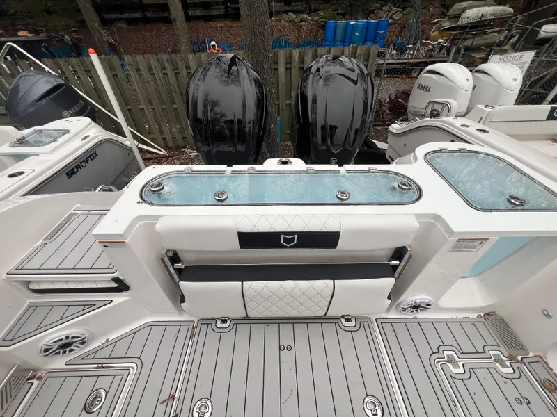 Slide: The Image of 2025 Sea Fox 328 Commander boat deck with dual outboard engines. - 9