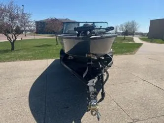 Slide: The Image of 2024 Ranger VS1882SC Angler boat on trailer, parked outdoors on a sunny day. - 1