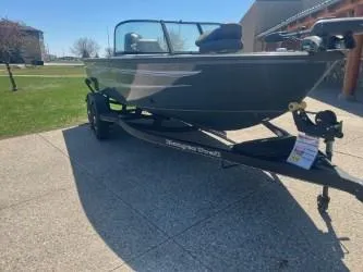Slide: The Image of 2024 Ranger VS1882SC Angler boat on trailer, parked outdoors on a sunny day. - 2