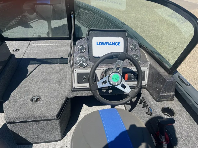 Slide: The Image of 2024 Ranger VS1882SC Angler boat dashboard with Lowrance display and steering wheel. - 4