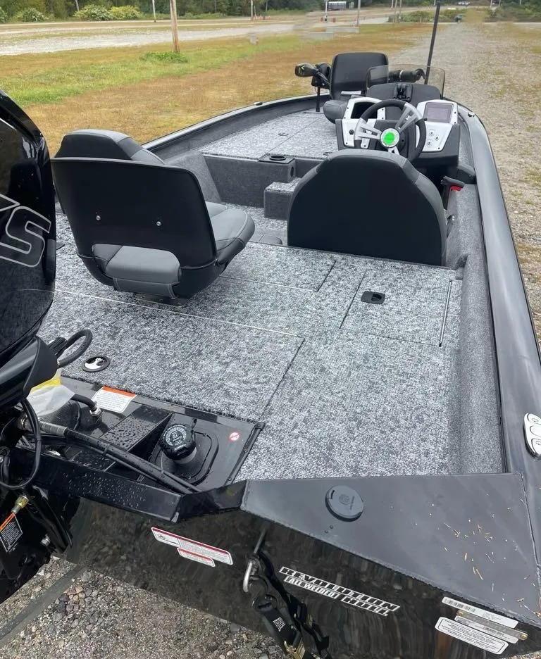 Slide: The Image of 2025 Tracker Pro Team 190 fishing boat with dual seats and modern dashboard. - 4