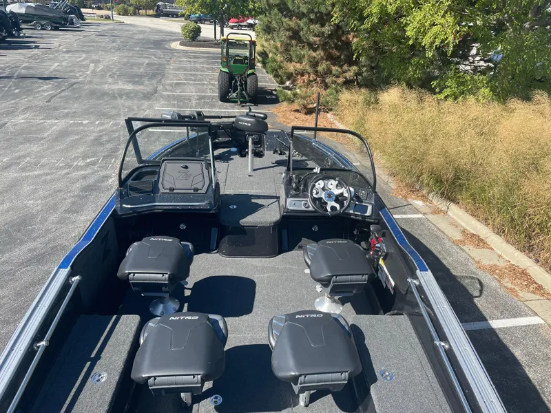 Slide: The Image of 2024 Nitro ZV20 Pro boat with four seats, parked outdoors. - 4