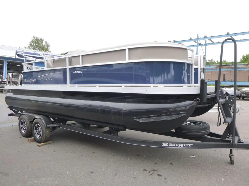 Slide: The Image of 2024 Ranger Reata 200C pontoon boat on trailer, side view. - 2
