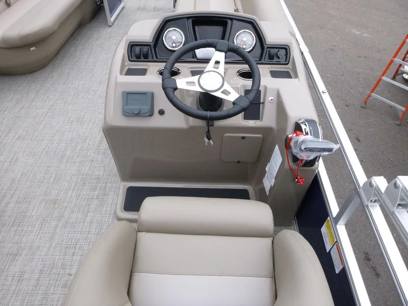 Slide: The Image of 2024 Ranger Reata 200C boat cockpit with steering wheel and controls. - 6