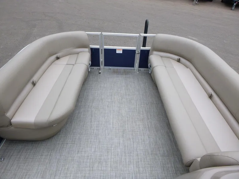 Slide: The Image of 2024 Ranger Reata 200C pontoon boat interior with beige seating and gray flooring. - 8