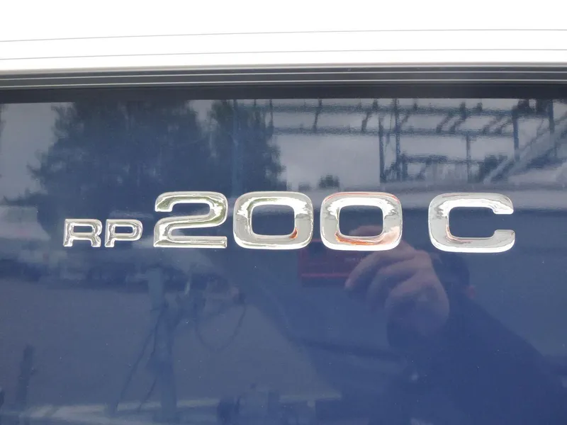 Slide: The Image of Close-up of Ranger Reata 200C 2024 model emblem on a reflective surface. - 9