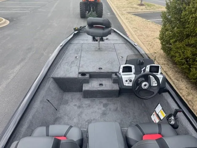 Slide: The Image of 2025 Tracker Pro Team 190 boat interior with steering console and seating. - 2