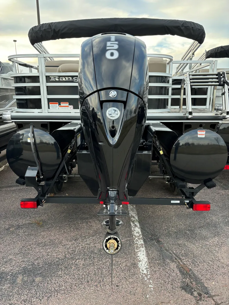 Slide: The Image of 2024 Ranger Reata 223FC boat with powerful outboard motor, rear view. - 4