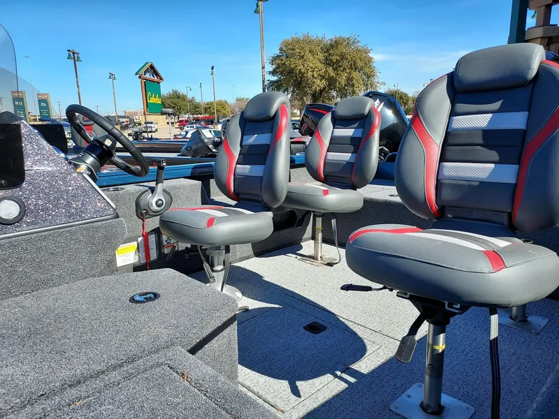 Slide: The Image of 2024 Ranger VS1782SC Angler boat interior with three cushioned seats and steering wheel. - 3