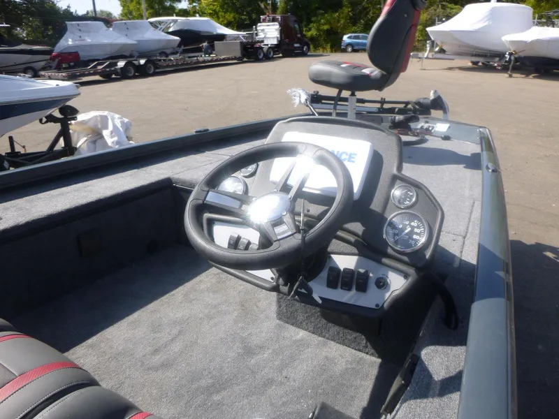 Slide: The Image of 2024 Ranger RT188C boat interior with steering wheel and dashboard controls. - 10