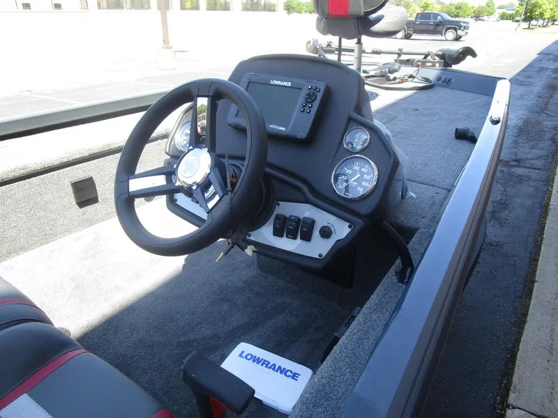 Slide: The Image of 2024 Ranger RT188C boat dashboard with steering wheel and Lowrance electronics. - 34