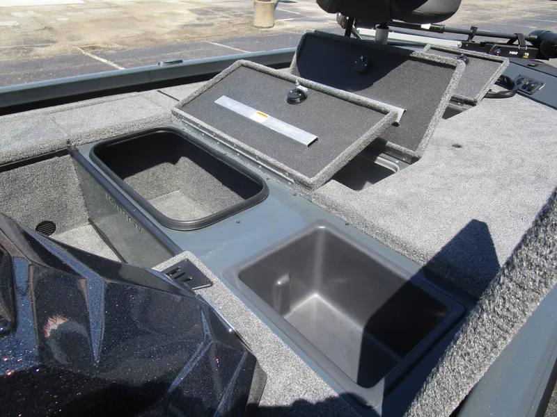 Slide: The Image of 2024 Ranger RT188C boat storage compartments with open lids, showcasing interior space. - 37