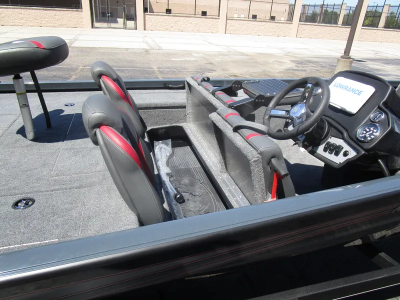 Slide: The Image of 2024 Ranger RT188C boat interior with steering wheel and seating, featuring Lowrance electronics. - 39