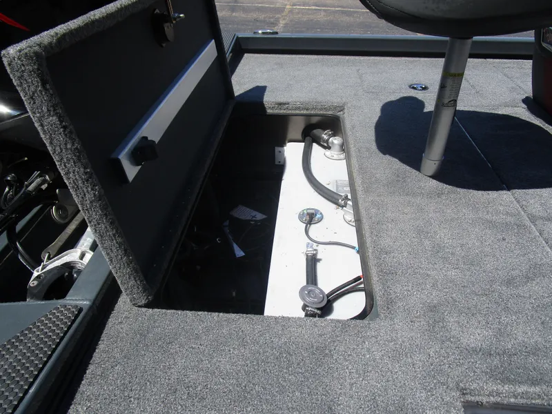 Slide: The Image of 2024 Ranger RT188C boat storage compartment with open hatch, revealing interior components. - 40