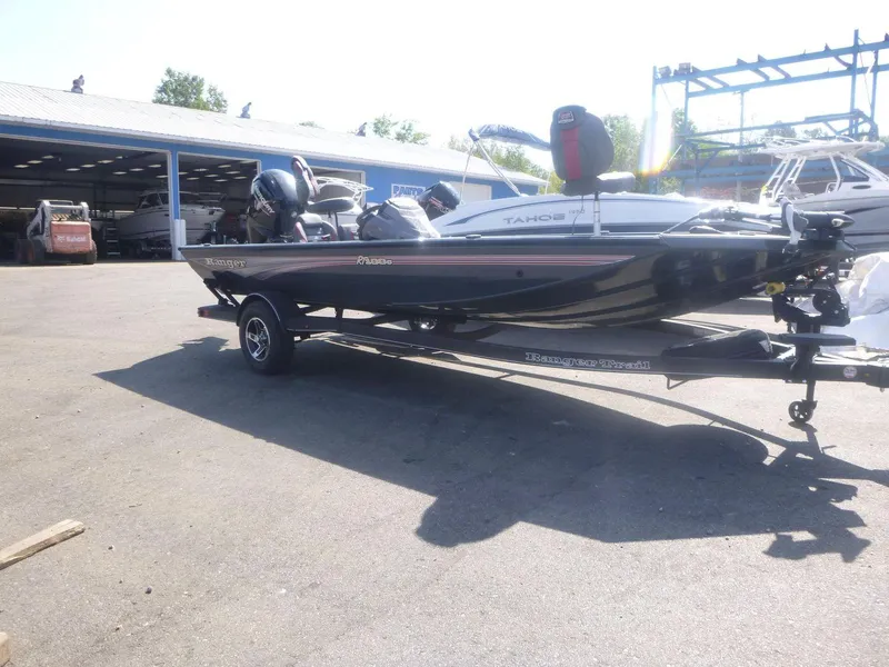 Slide: The Image of 2024 Ranger RT188C boat on trailer in outdoor storage area. - 6