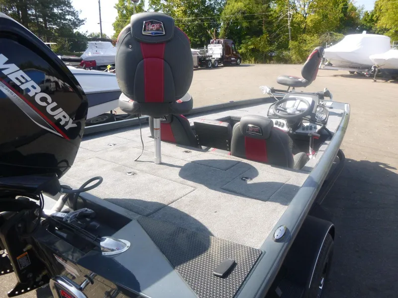 Slide: The Image of 2024 Ranger RT188C fishing boat with Mercury engine, spacious deck, and seating. - 9