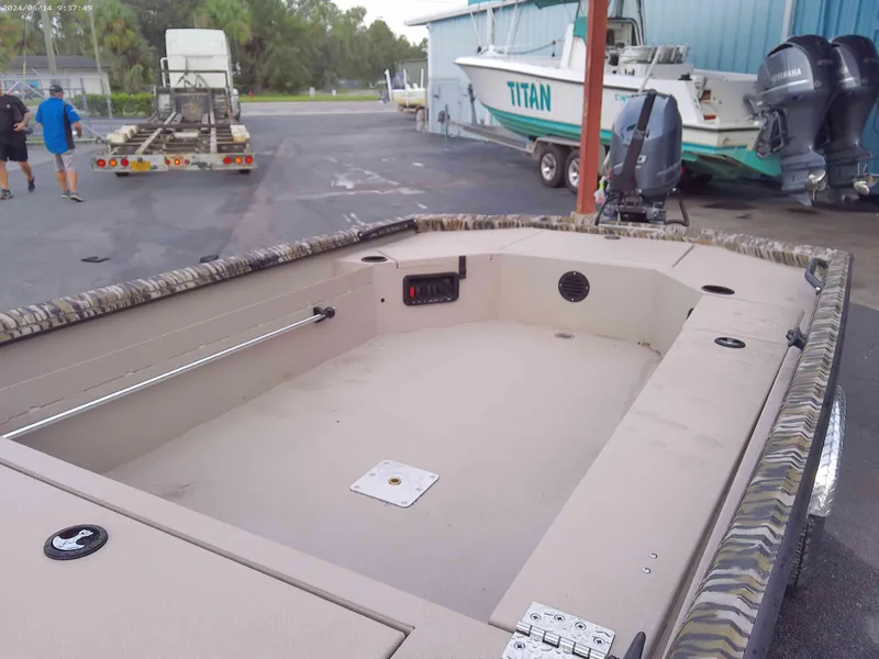 Slide: The Image of Avid 16 Commander 2025 boat interior, featuring spacious deck and modern design. - 4