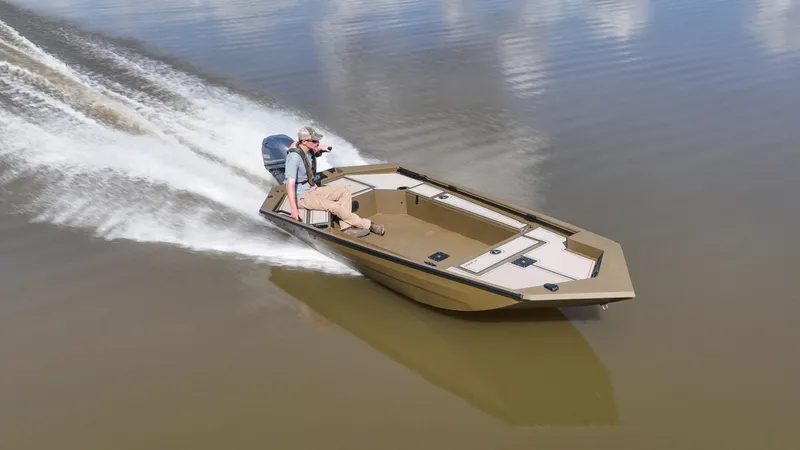 Slide: The Image of Avid 16 Commander 2025 boat speeding on calm water. - 7