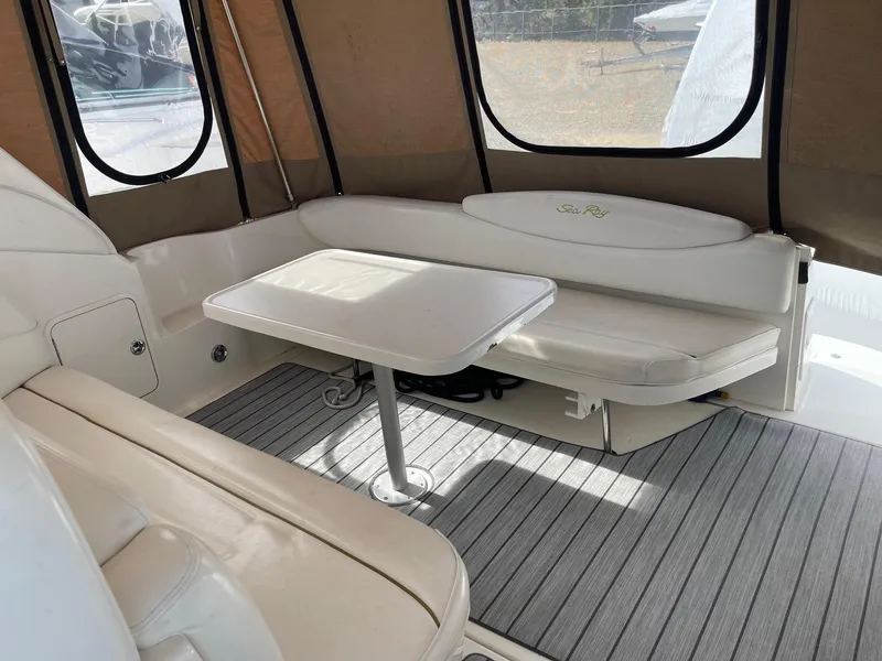 Slide: The Image of Interior of 2002 Sea Ray 340 Sundancer with seating and table. - 21