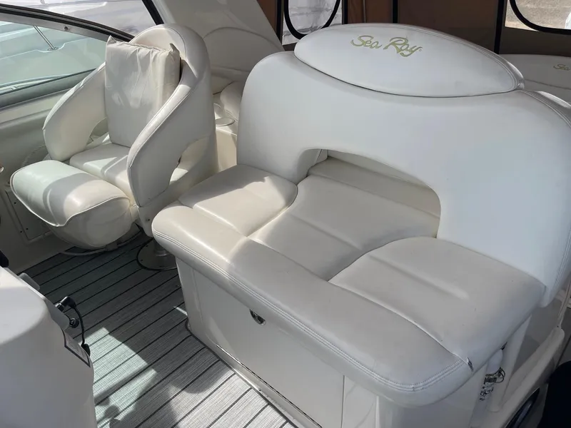 Slide: The Image of 2002 Sea Ray 340 Sundancer interior with white leather seating. - 22