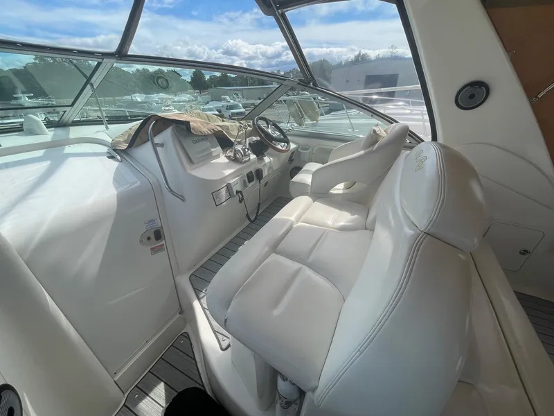 Slide: The Image of Interior of 2002 Sea Ray 340 Sundancer boat with white leather seating. - 24