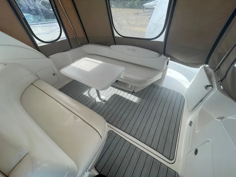 Slide: The Image of Interior of 2002 Sea Ray 340 Sundancer with seating and table. - 26