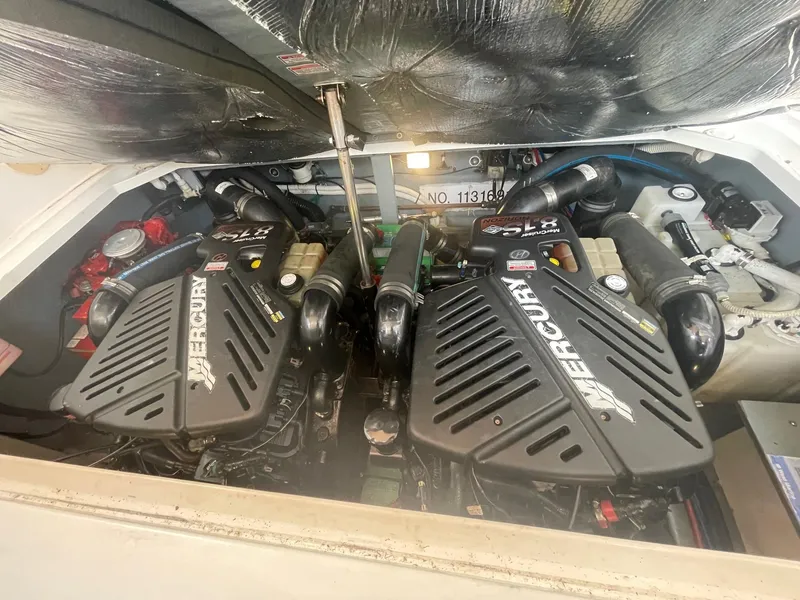 Slide: The Image of Twin Mercury engines in a 2002 Sea Ray 340 Sundancer boat. - 30