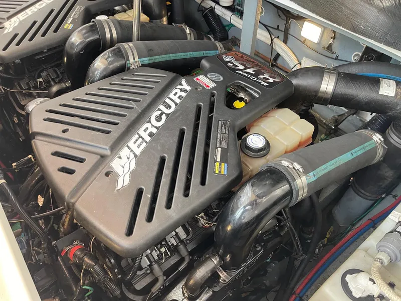Slide: The Image of Engine compartment of 2002 Sea Ray 340 Sundancer with Mercury engines. - 31