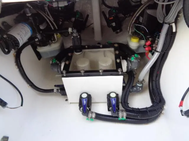 Slide: The Image of Engine compartment of a 2022 Contender 32 ST boat, showcasing wiring and components. - 17